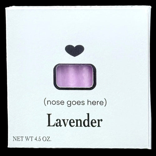 Lavender product packaging with a black heart symbol on a dark background